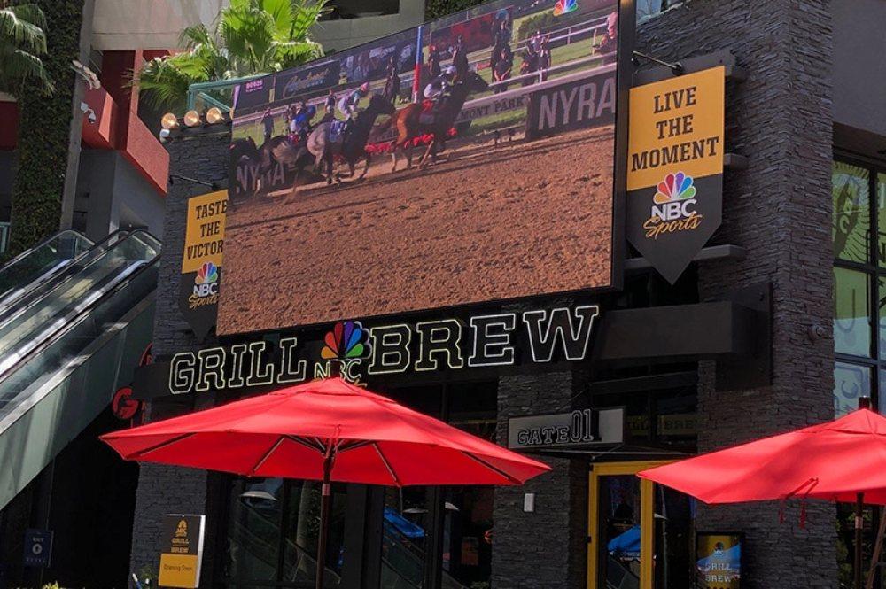 A restaurant displays their name on the front of their building using the Performance Series LED display from Nanolumens.