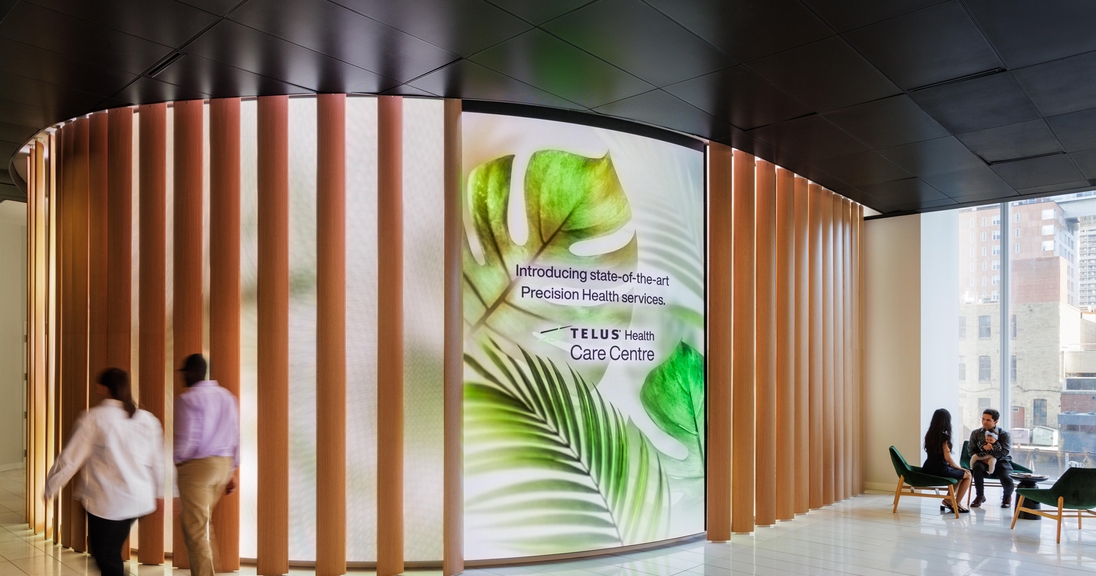 A large LED screen in a hallway, emphasizing customizable LED displays for a polished visual experience. Photo by Klassen Photography.