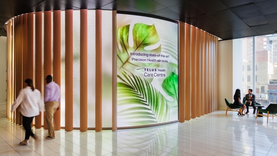 A large LED screen in a hallway, emphasizing customizable LED displays for a polished visual experience. Photo by Klassen Photography.